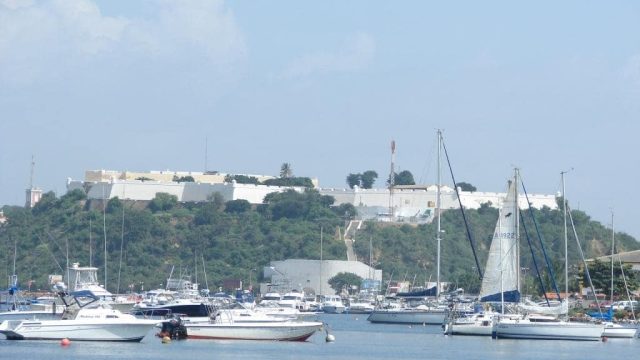 Luanda shore line in Angola with boats moored near to the city.