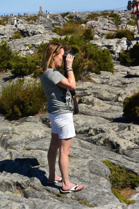 Women using binoculars at top of Table Mountain CapeTown.