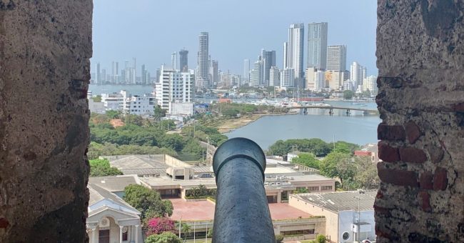 Cannon in fortress looking over city.
