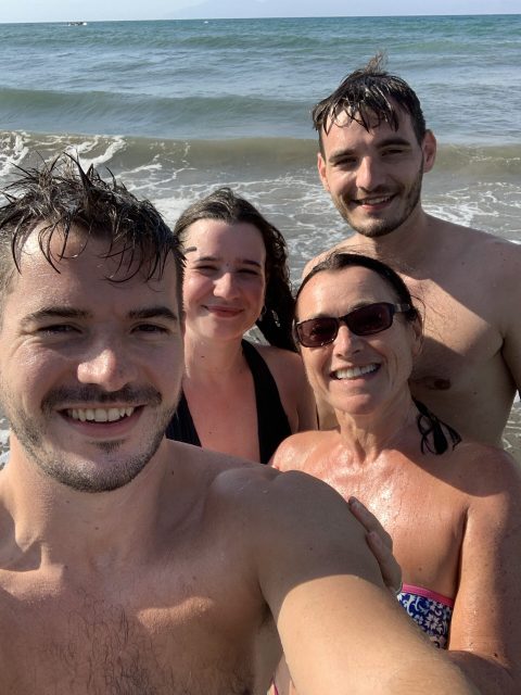Group of tourists at a beach.