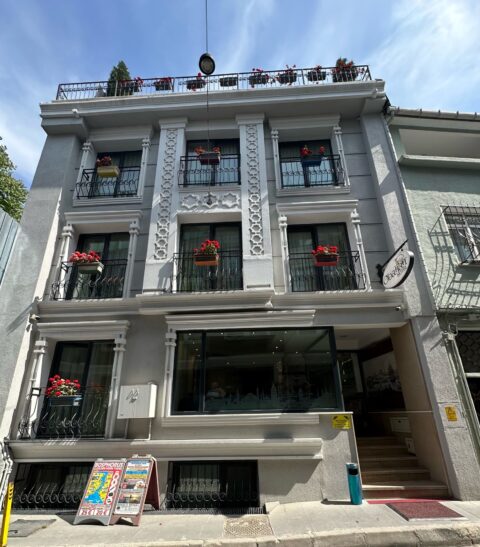 Obanhan Hotel Istanbul. 3-story building with flower boxes and a roof terrace.