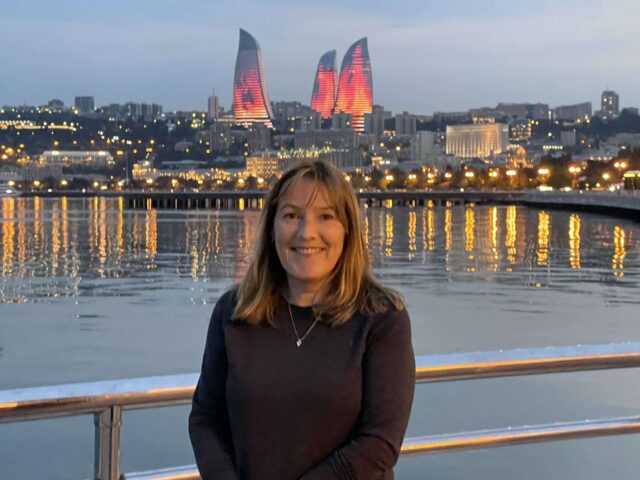 Nightfall in Baku brings bright lights of the 3 Flame Towers and lights shimming on the Caspian Sea waters.