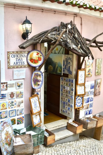 Ceramic plates and tiles decorate the entrance to an arts shop in Sintra, Portugal.