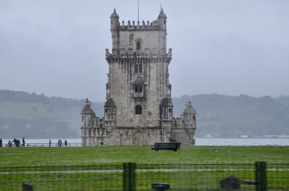 A tower in the Tagus River with turrets and a high look out balcony.