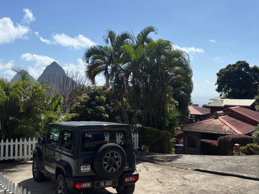 A jeep parked in St Lucia being used on a Road Trip.