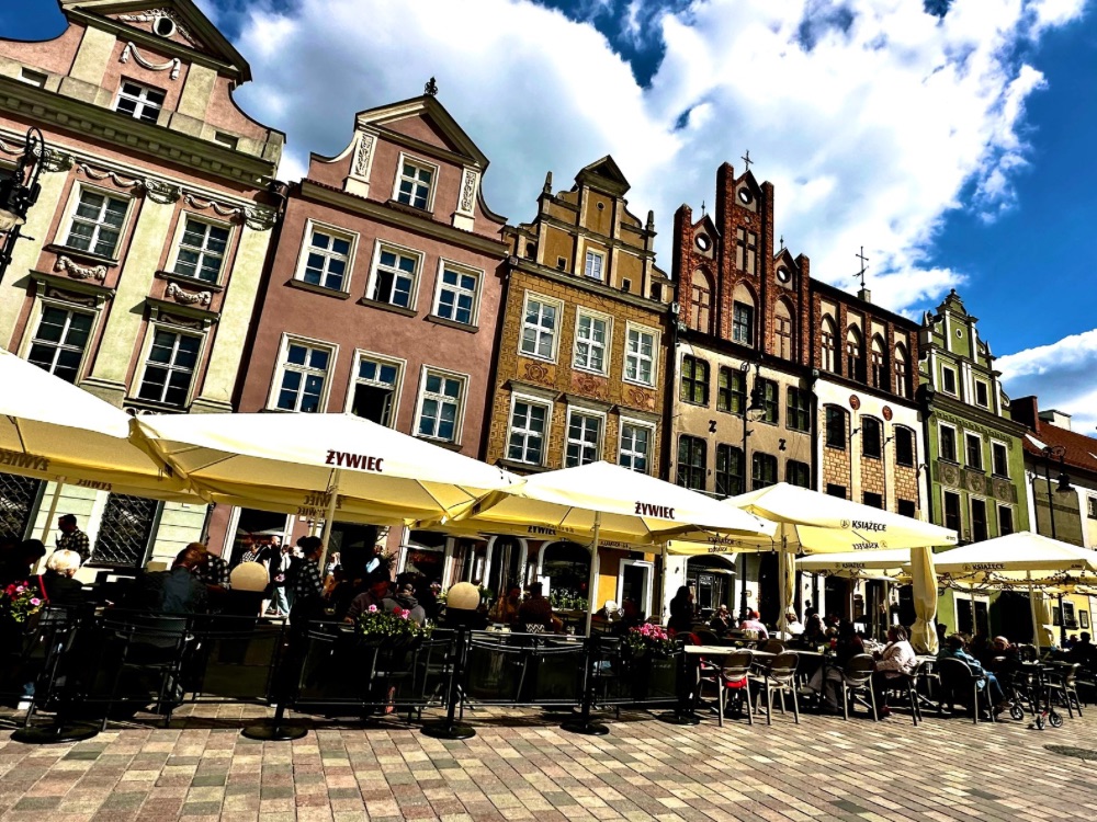 Rows of multi story, coloured building in the old market square Poznan